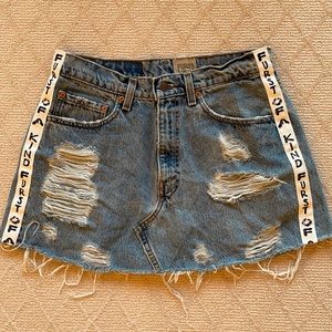 Distressed denim mini skirt